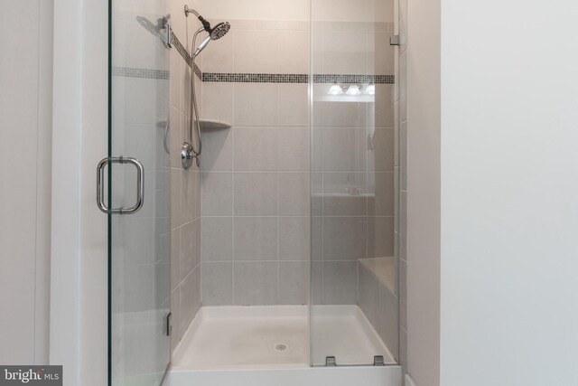 bathroom featuring a shower stall