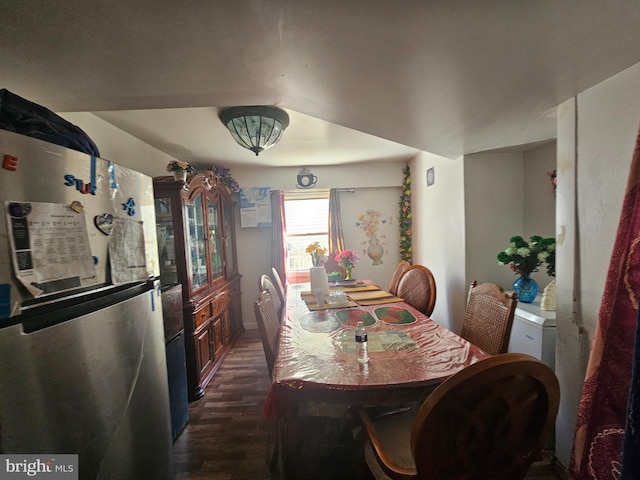 dining space with dark wood finished floors