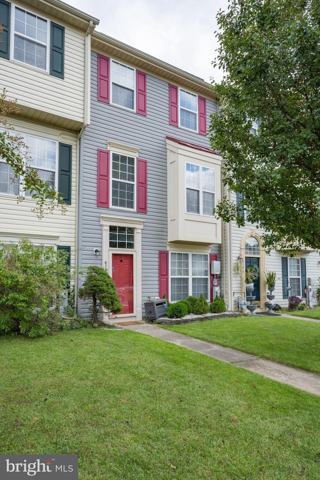 view of property with a front lawn