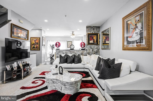 living area featuring carpet flooring, recessed lighting, and a ceiling fan