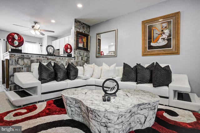 living area with recessed lighting and ceiling fan