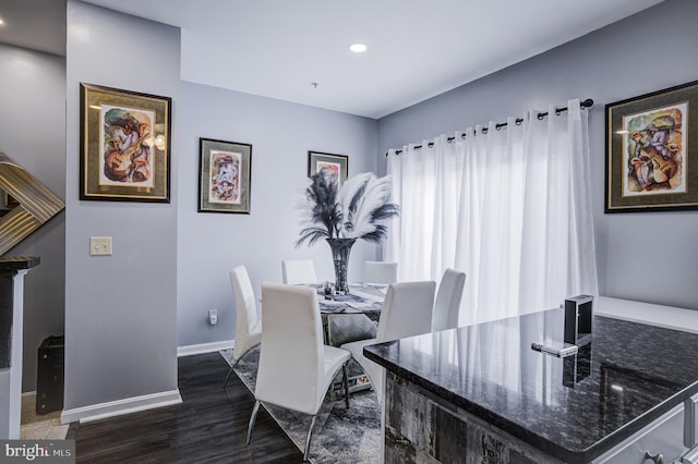 dining room featuring dark wood finished floors, recessed lighting, and baseboards