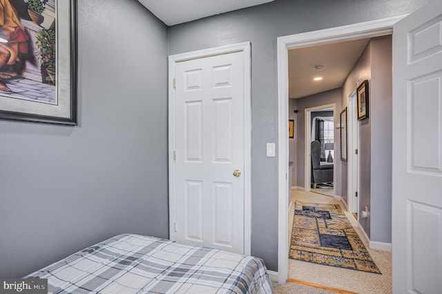 carpeted bedroom with baseboards