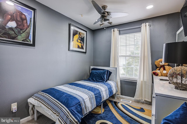 bedroom with visible vents, a ceiling fan, and baseboards