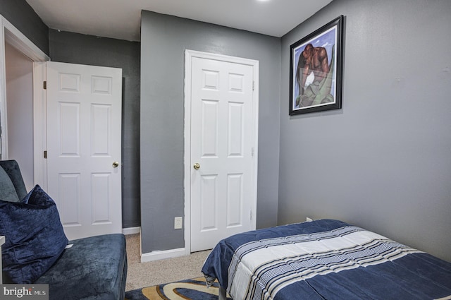 bedroom with baseboards and carpet floors