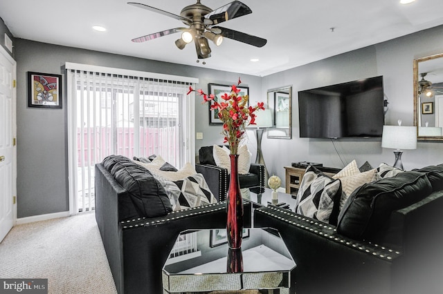 living area with recessed lighting, baseboards, a ceiling fan, and carpet floors