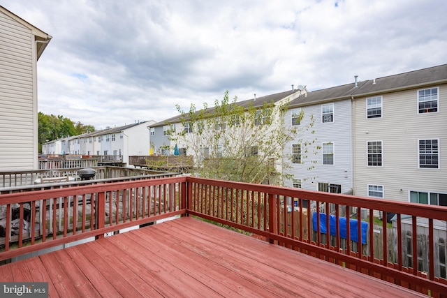 wooden deck with a residential view