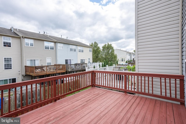 wooden deck featuring fence and a residential view