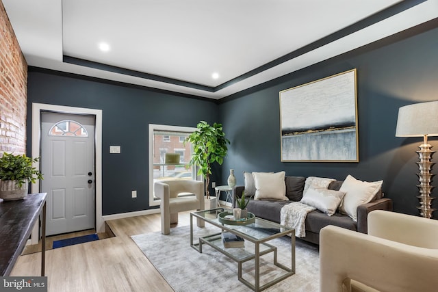 living room featuring baseboards and light wood finished floors