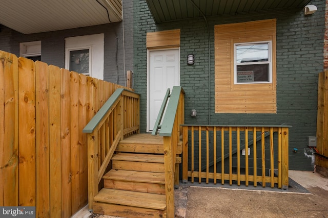 entrance to property with brick siding