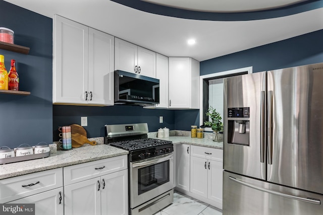 kitchen with light stone countertops, open shelves, appliances with stainless steel finishes, white cabinetry, and marble finish floor