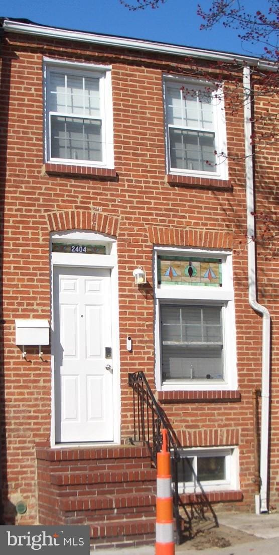 multi unit property featuring brick siding