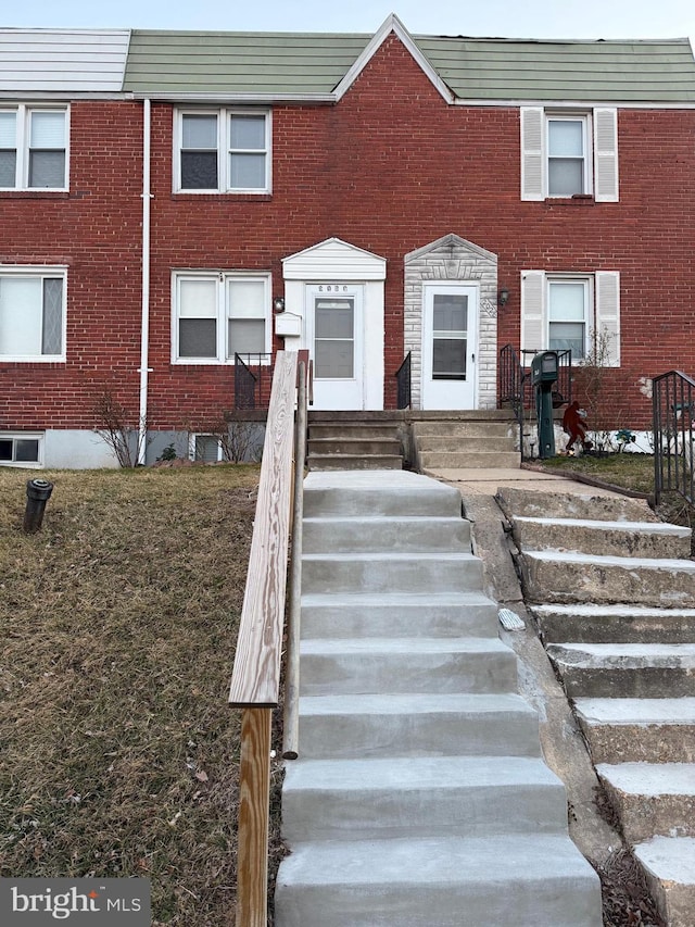 multi unit property featuring brick siding