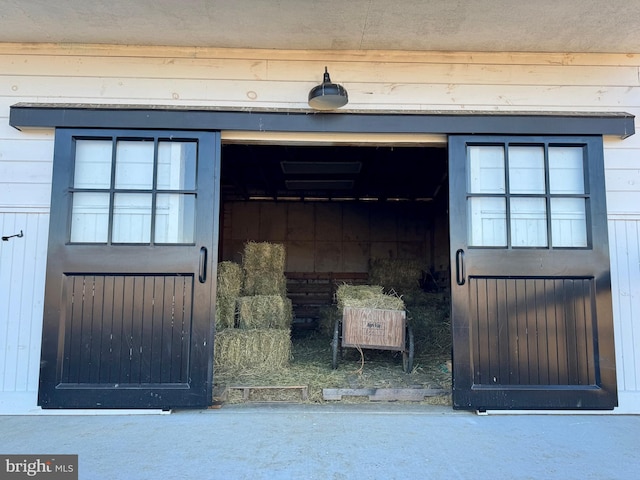 view of exterior entry featuring a garage