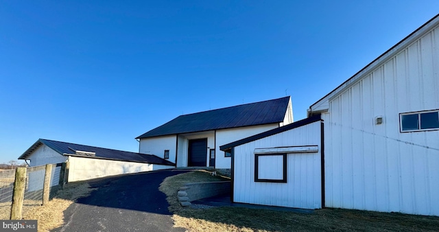 exterior space featuring metal roof