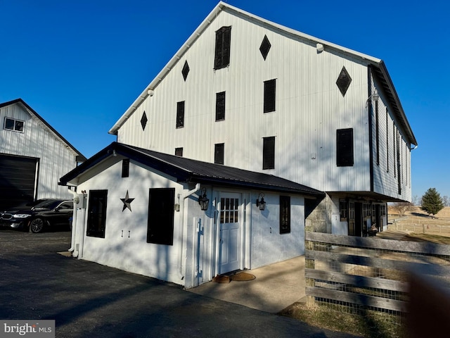 view of front of house featuring metal roof and board and batten siding