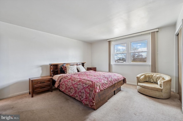 bedroom with baseboards and carpet floors