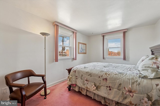 carpeted bedroom with baseboards