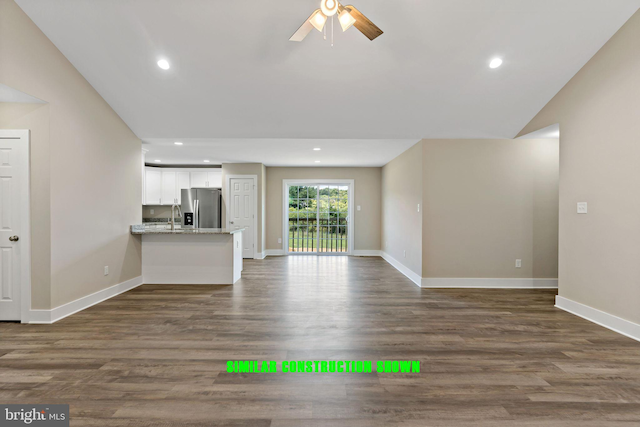 unfurnished living room featuring recessed lighting, baseboards, dark wood-type flooring, and a ceiling fan