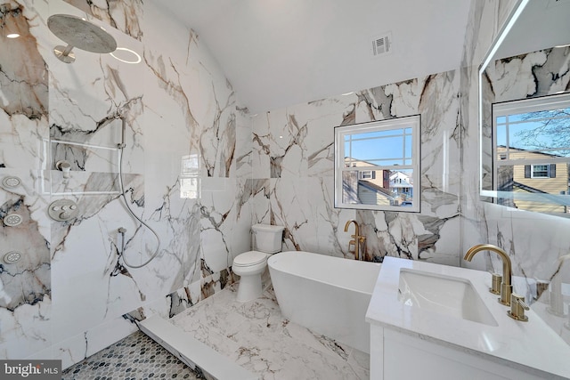 bathroom featuring a marble finish shower, a soaking tub, visible vents, toilet, and stone wall