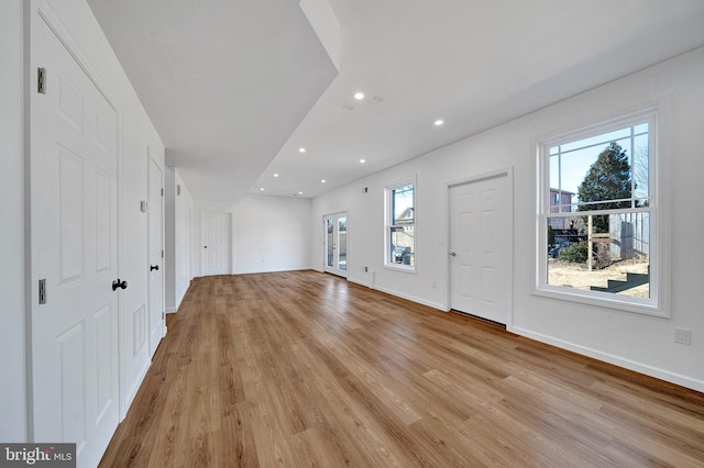 entrance foyer featuring light wood-style flooring, baseboards, and recessed lighting