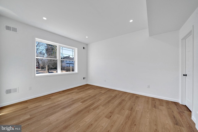 unfurnished bedroom with light wood-style flooring, visible vents, and baseboards