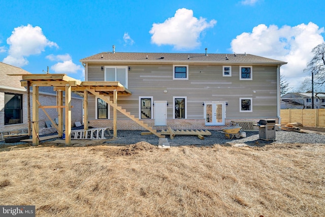 back of house featuring french doors