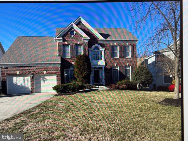 view of front of house with driveway, a front lawn, and brick siding