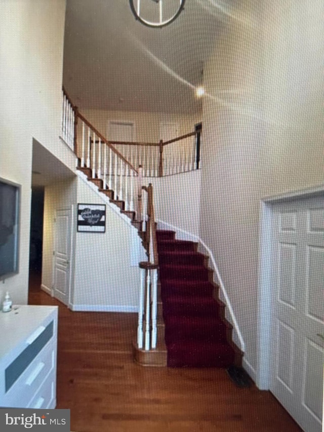 stairs with wood finished floors