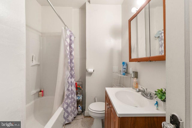 full bathroom featuring tile patterned flooring, vanity, toilet, and shower / bath combo with shower curtain