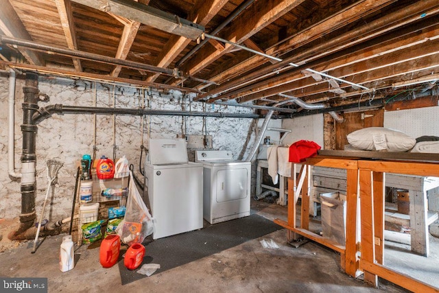 unfinished basement featuring washing machine and dryer