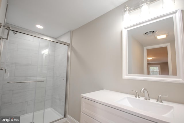 bathroom featuring a stall shower, recessed lighting, visible vents, and vanity