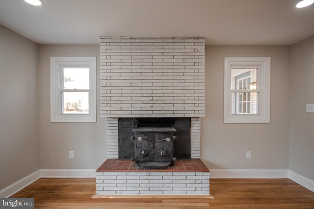 room details with recessed lighting, wood finished floors, and baseboards