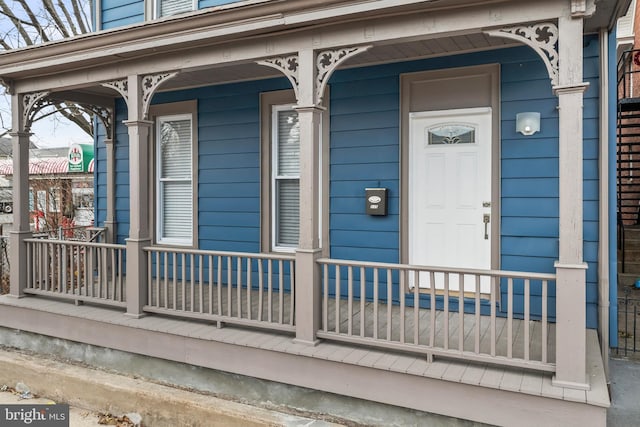 property entrance with covered porch