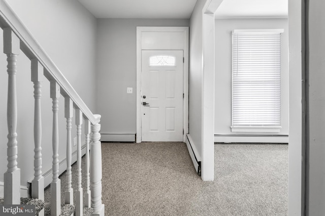 entrance foyer featuring carpet floors, a baseboard radiator, stairway, and baseboards