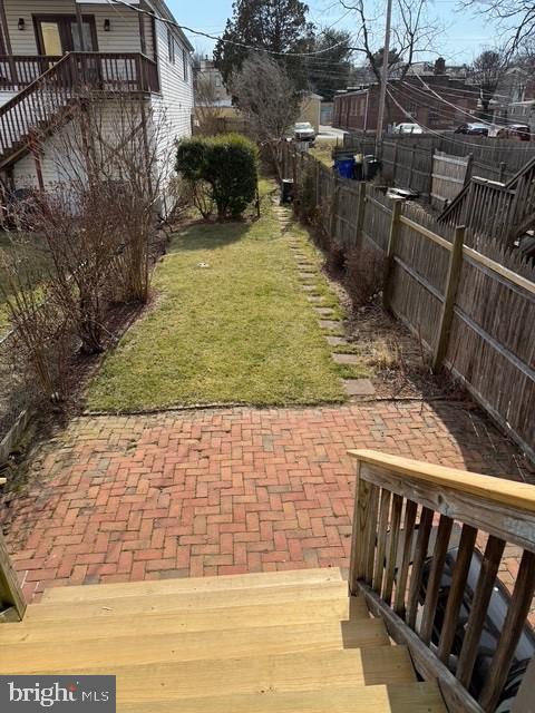 view of yard featuring a patio area and fence