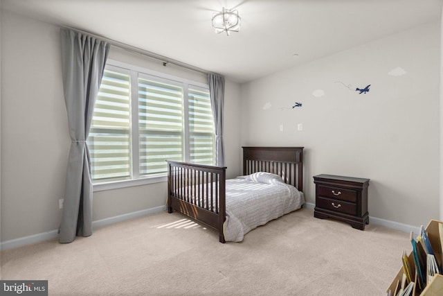 carpeted bedroom with baseboards