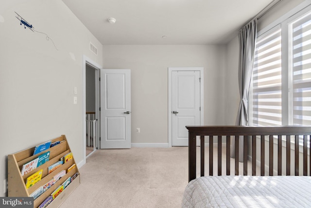 bedroom featuring baseboards, visible vents, and carpet floors