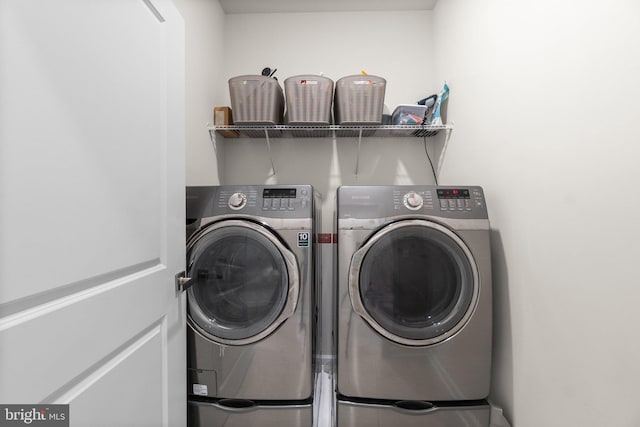 laundry room with washer and dryer and laundry area