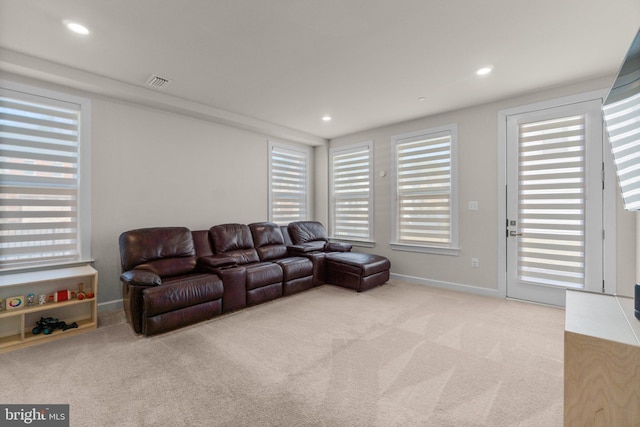 living room with recessed lighting, carpet, visible vents, and baseboards