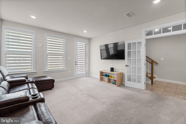 carpeted living area featuring visible vents, recessed lighting, french doors, and baseboards