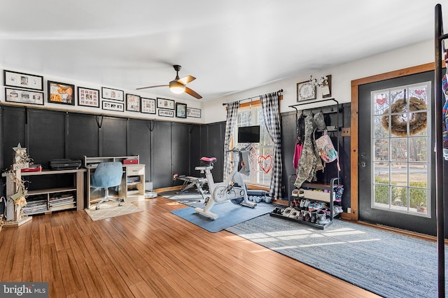 workout room featuring a ceiling fan and hardwood / wood-style flooring