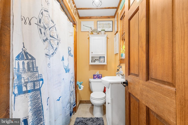 bathroom with a sink, a shower with shower curtain, tile patterned flooring, and toilet