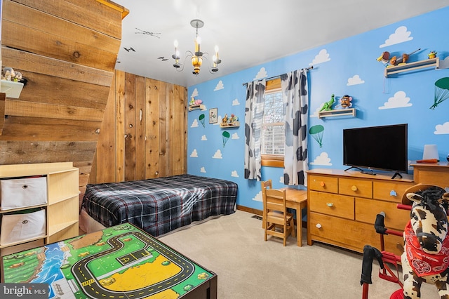 bedroom featuring baseboards, a chandelier, and carpet flooring