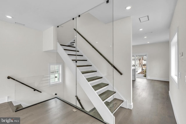 stairs featuring recessed lighting, baseboards, and wood finished floors