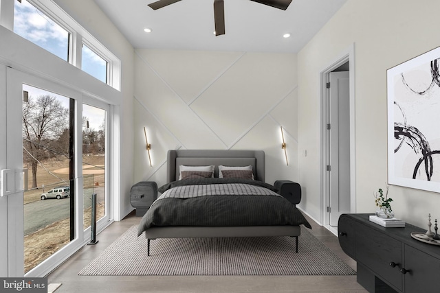 bedroom with ceiling fan, wood finished floors, and recessed lighting