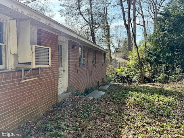 view of home's exterior with brick siding