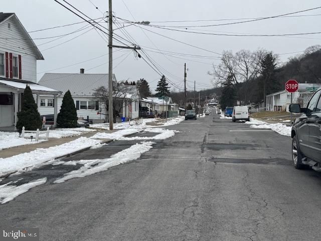 view of street with traffic signs and a residential view