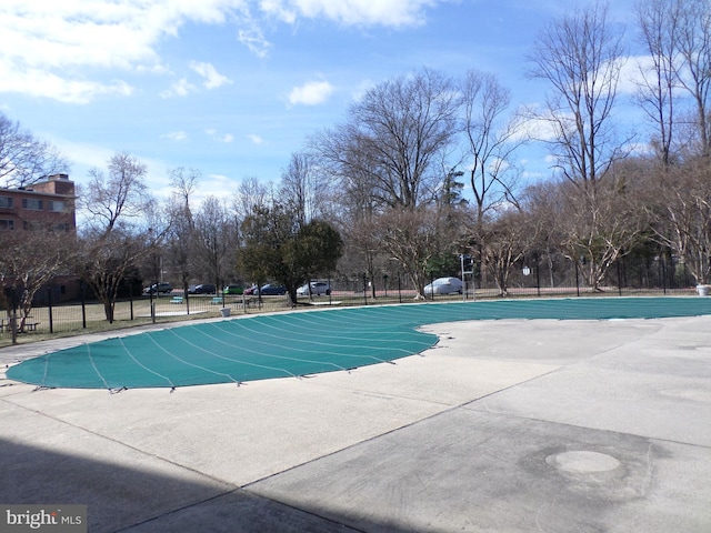 view of pool with community basketball court