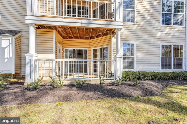 entrance to property with a balcony